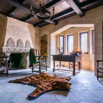 a room with a stone fireplace